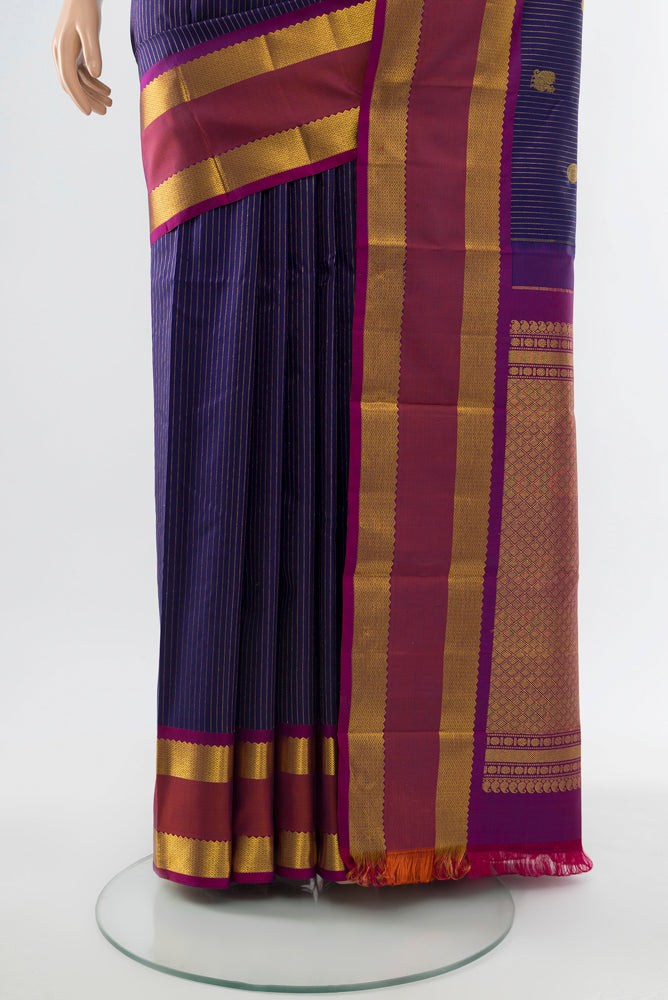 Pleats and pallu of Navy Blue Kanjivaram Silk Saree with Zari Butta on the body and Silk Border. 