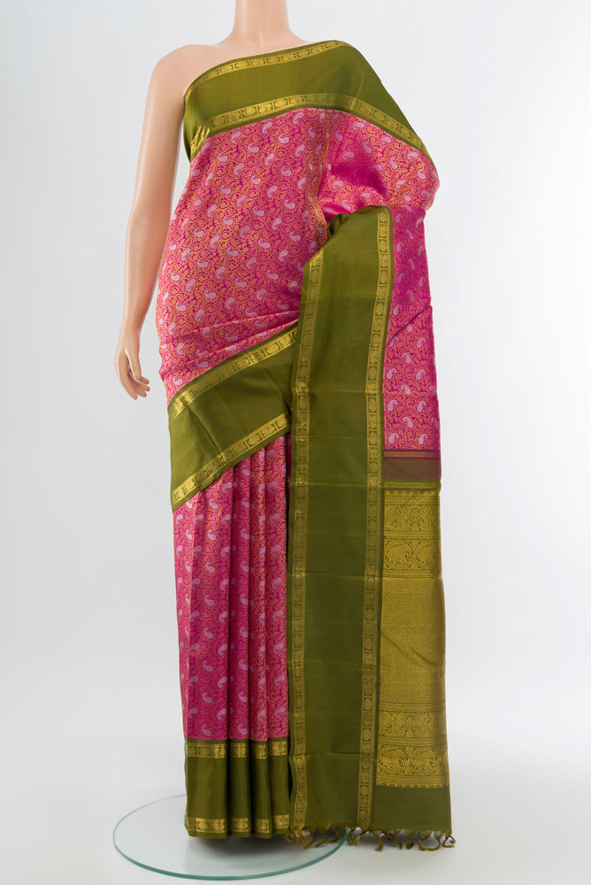 Pure Silk Pure Zari Purple Kanchipuram Saree with Zari Butta on the body and Silk Border.  displayed on a mannequin