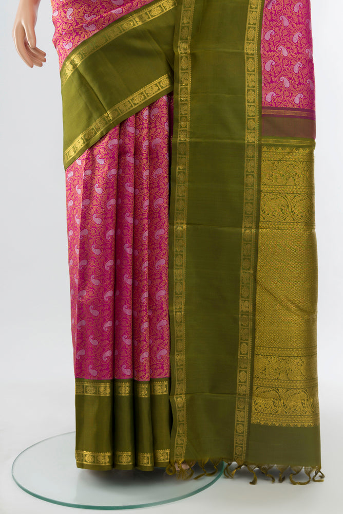 Pleats and pallu of Pure Silk Pure Zari Purple Kanchipuram Saree with Zari Butta on the body and Silk Border. 