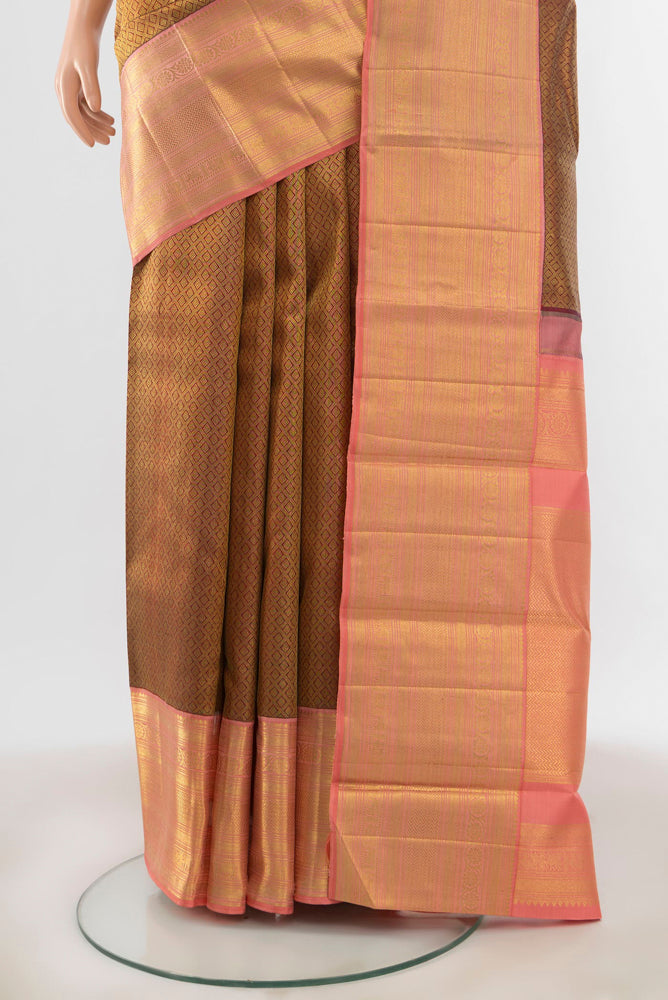 Pleats and pallu of Maroon Kanchipuram Silk Saree with Zari Butta on the body and Silk Border. 