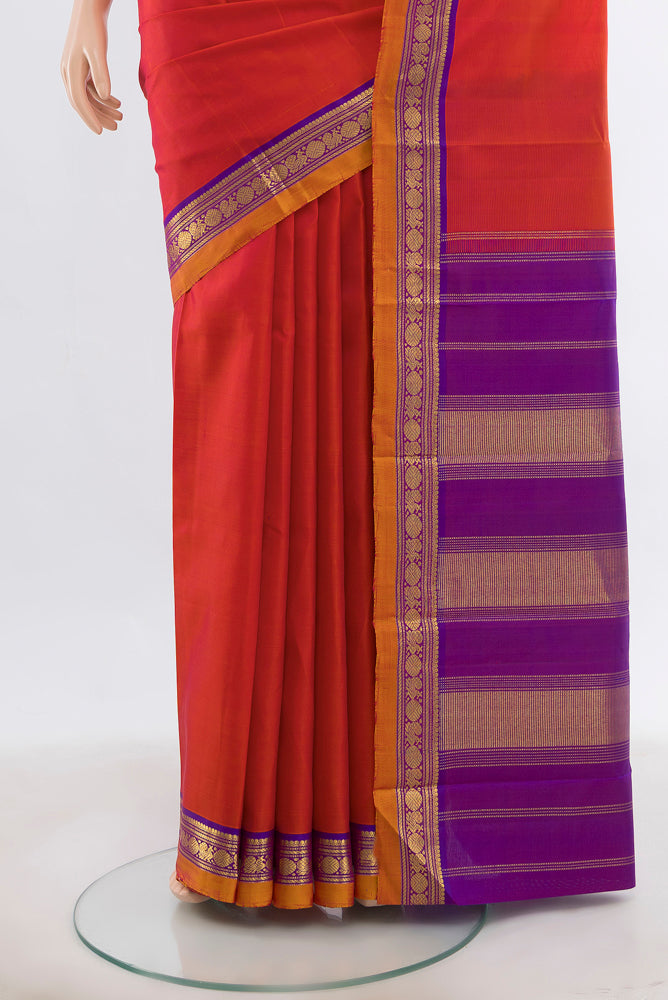 Pleats and pallu of Peach Kanjivaram Silk Saree with Zari Butta on the body and Silk Border. 