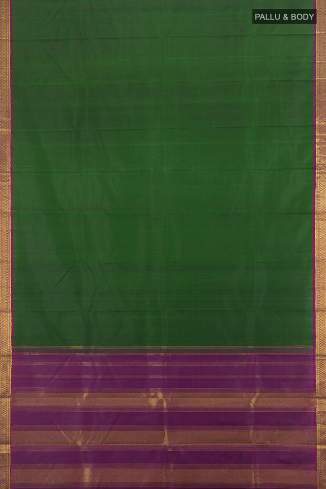 Flat view of Pure Silk Pure Zari Bottle Green Kanjivaram Saree with Zari Butta on the body and Silk Border. 