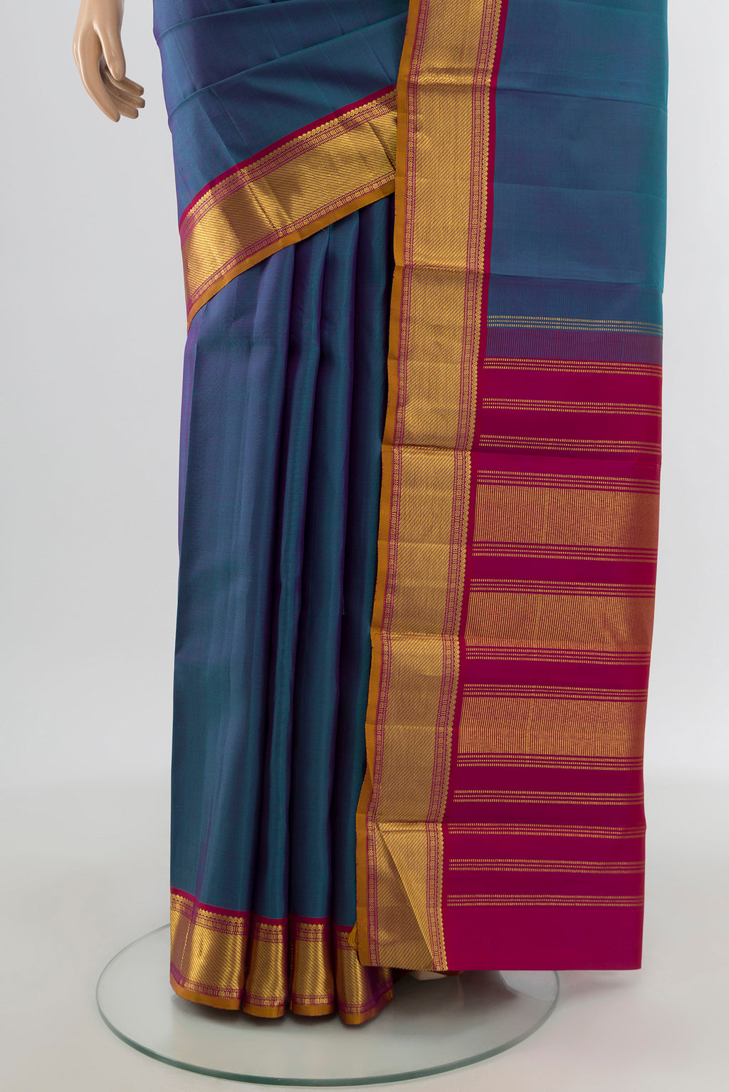 Pleats and pallu of Multi Color Kanchipuram Silk Saree with Plain Body and Zari Border. 