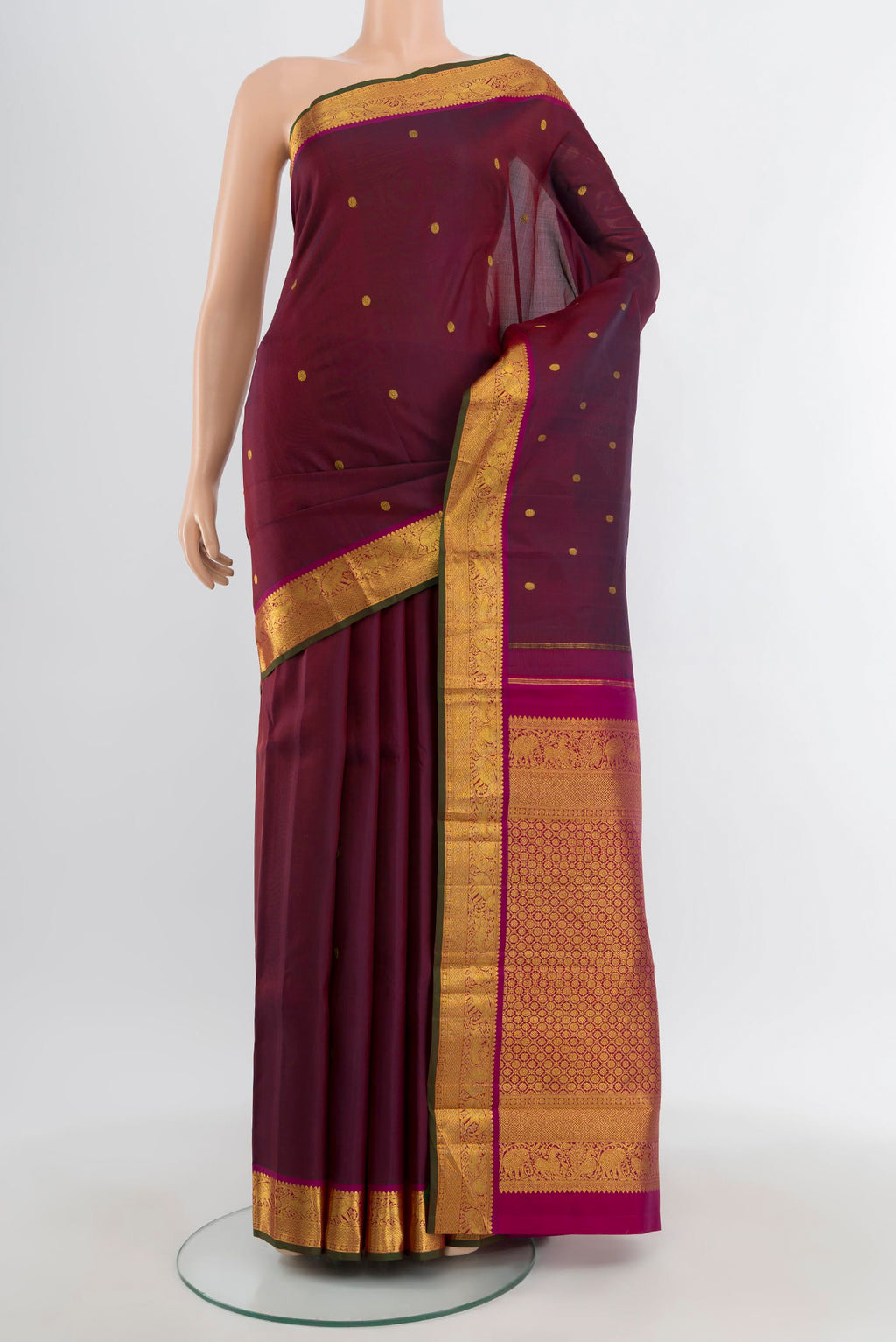 Maroon Kanjivaram Silk Saree with Zari Butta on the body and Zari Border.  displayed on a mannequin