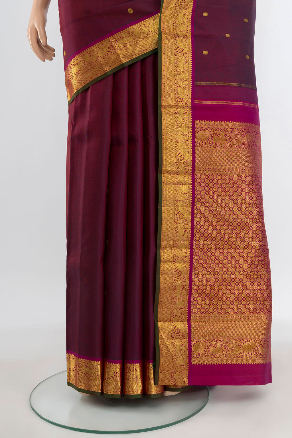 Pleats and pallu of Maroon Kanjivaram Silk Saree with Zari Butta on the body and Zari Border. 