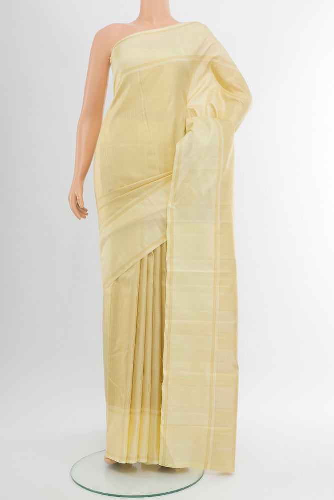 Pure Silk Pure Zari Golden Kanjivaram Saree with Zari Butta on the body and Silk Border.  displayed on a mannequin
