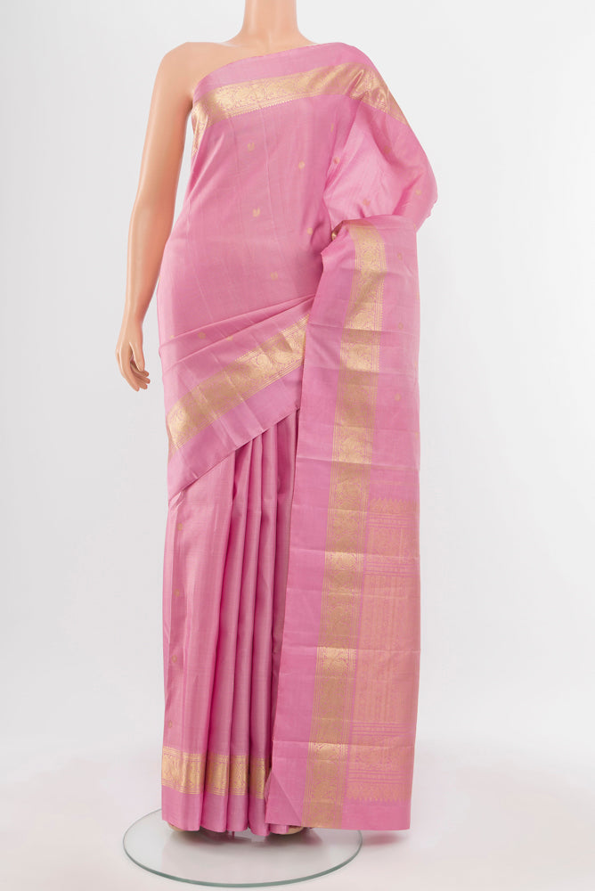 Rose Gold Kanjivaram Silk Saree with Zari Butta on the body and Silk Border.  displayed on a mannequin