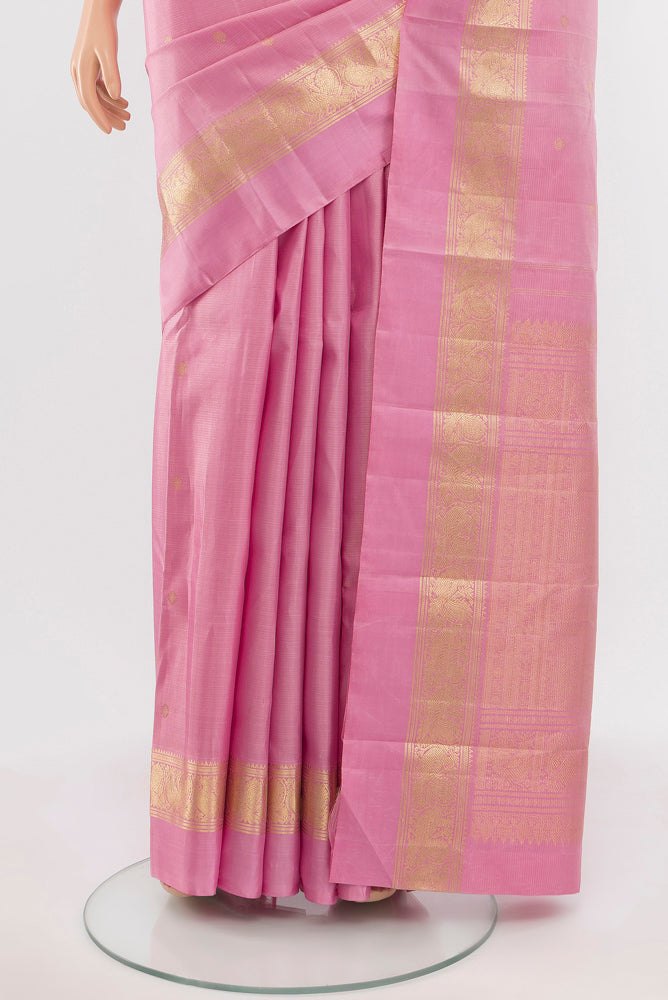 Pleats and pallu of Rose Gold Kanjivaram Silk Saree with Zari Butta on the body and Silk Border. 