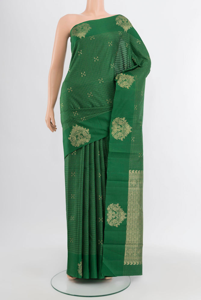 Bottle Green Kanjivaram Silk Saree with Zari Butta on the body and Silk Border.  displayed on a mannequin