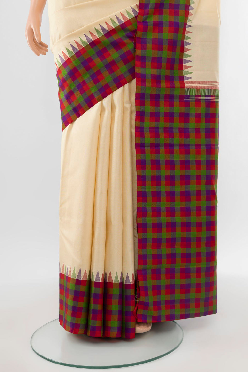 Pleats and pallu of Pure Silk Pure Zari Cream Kanjivaram Saree with Zari Butta on the body and Silk Border. 