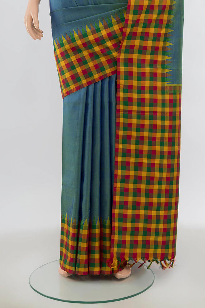 Pleats and pallu of Light Blue Kanjivaram Silk Saree with Zari Butta on the body and Silk Border. 