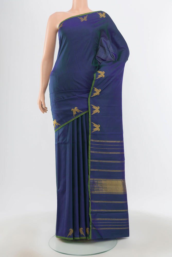 Pure Silk Pure Zari Dark Blue Kanjivaram Saree with Zari Butta on the body and Silk Border.  displayed on a mannequin