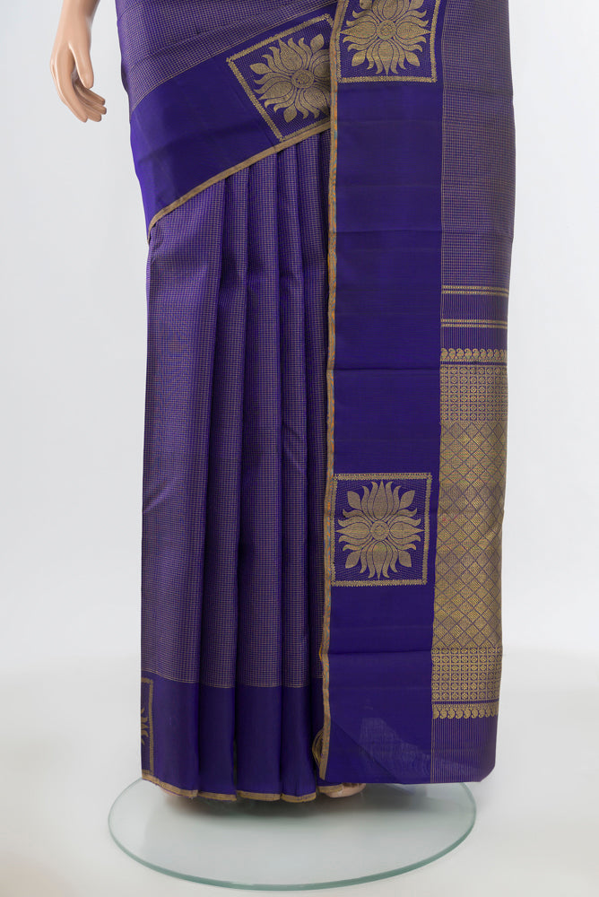 Pleats and pallu of Pure Silk Pure Zari Violet Kanjivaram Saree with Zari Butta on the body and Silk Border. 