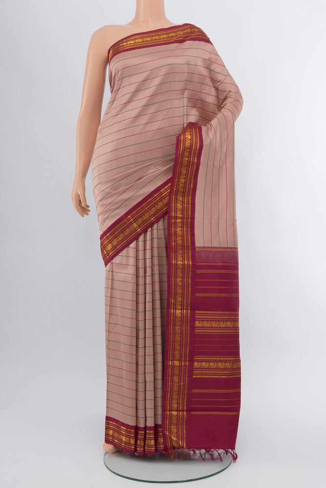 Multi Color Kanjivaram Silk Saree with Zari Brocade on the body and Silk Border.  displayed on a mannequin