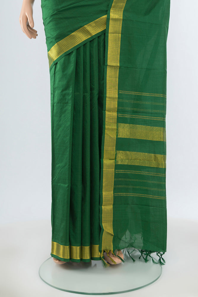 Pleats and pallu of Bottle Green Kanjivaram Silk Saree with Plain Body and Silk Border. 