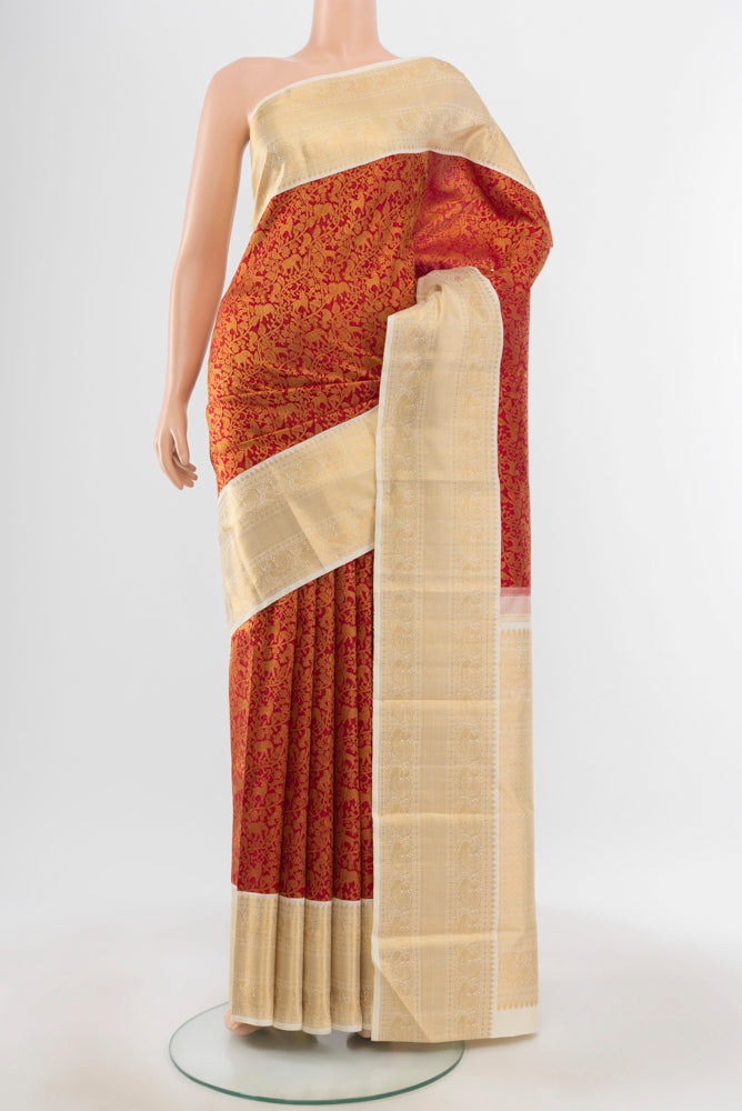 Pure Silk Pure Zari Maroon Kanchipuram Saree with Zari Butta on the body and Silk Border.  displayed on a mannequin