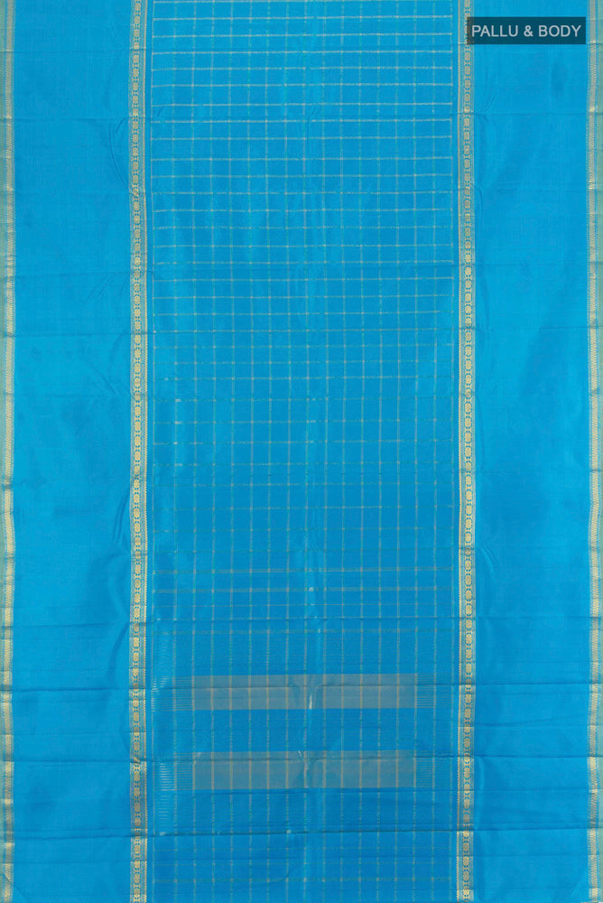 Flat view of Pure Silk Pure Zari Light Blue Kanchipuram Saree with Zari Butta on the body and Silk Border. 
