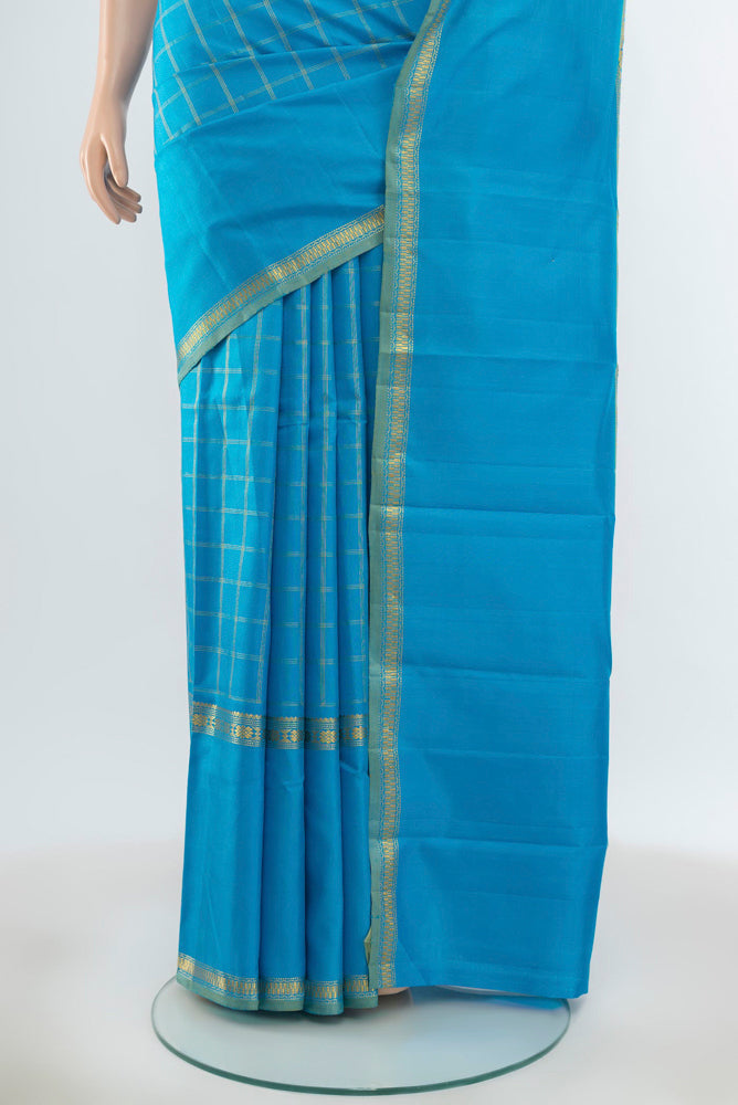 Pleats and pallu of Pure Silk Pure Zari Light Blue Kanchipuram Saree with Zari Butta on the body and Silk Border. 