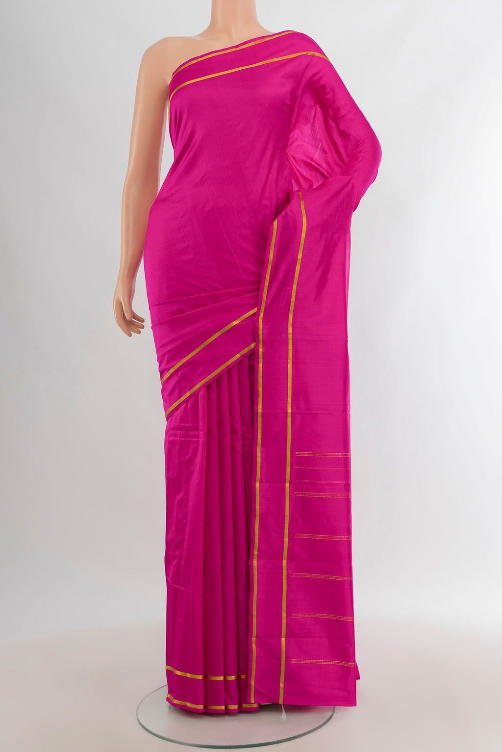 Magenta Kanjivaram Silk Saree with Plain Body and Zari Border.  displayed on a mannequin
