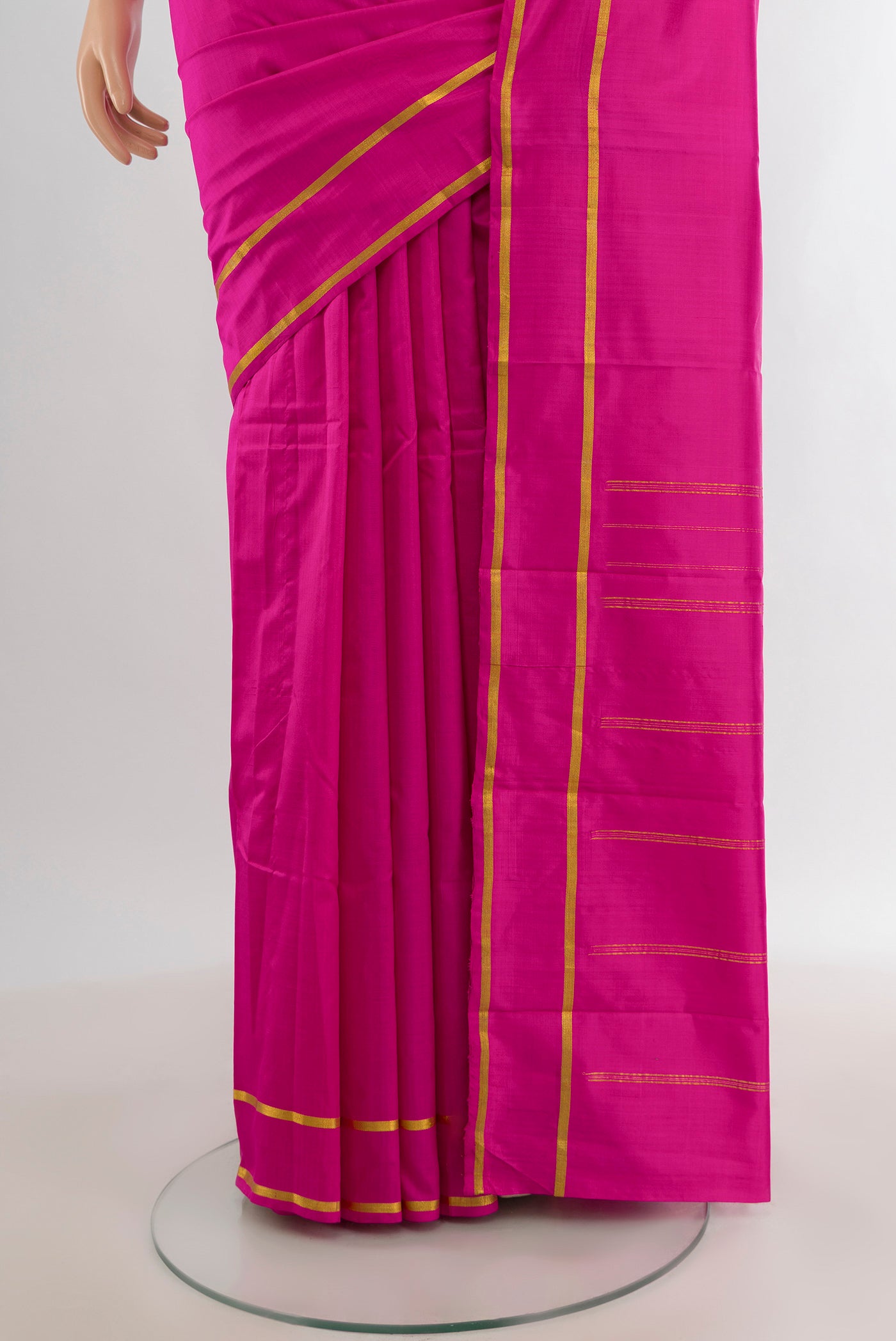 Pleats and pallu of Magenta Kanjivaram Silk Saree with Plain Body and Zari Border. 