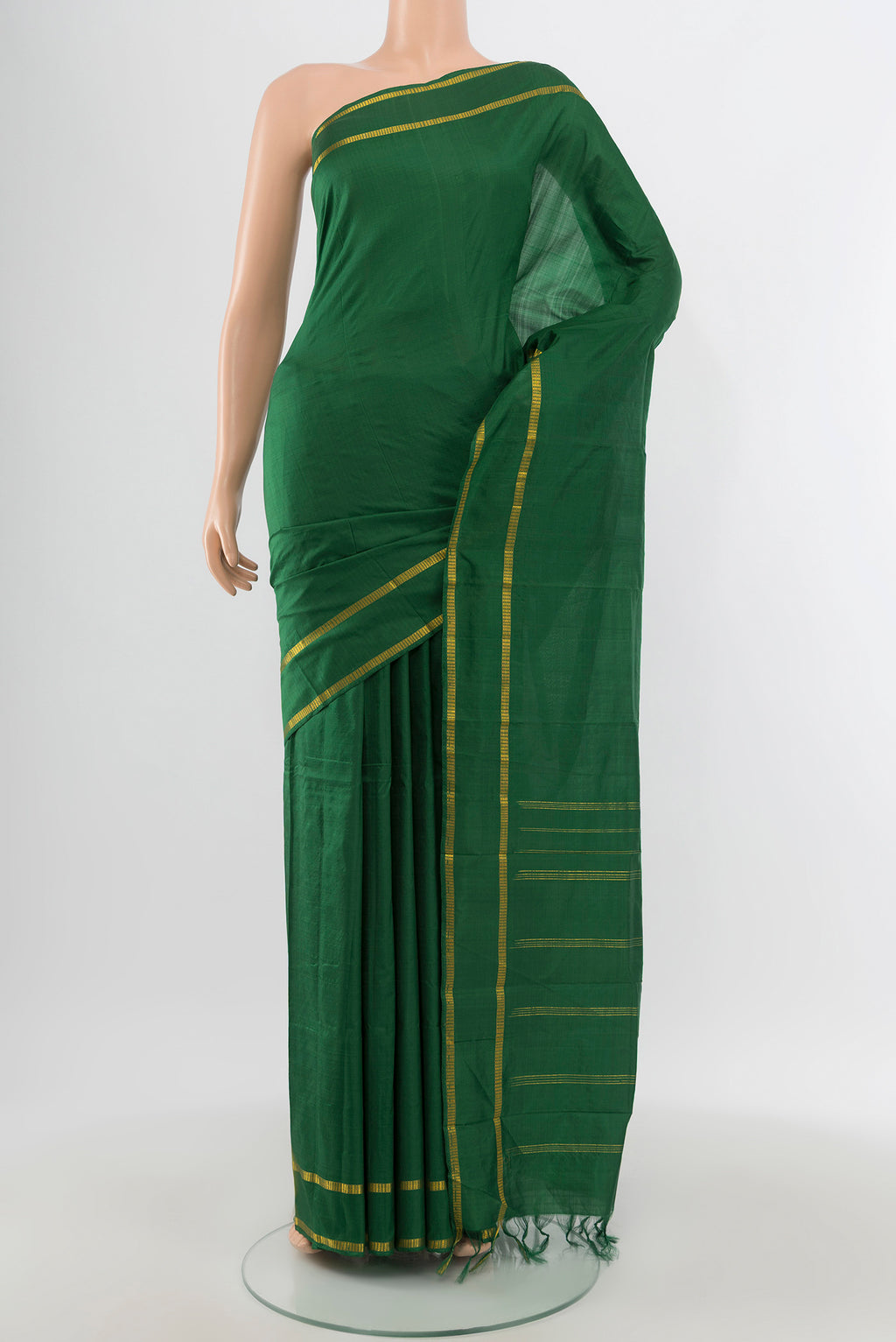 Bottle Green Kanchipuram Silk Saree with Plain Body and Zari Border.  displayed on a mannequin