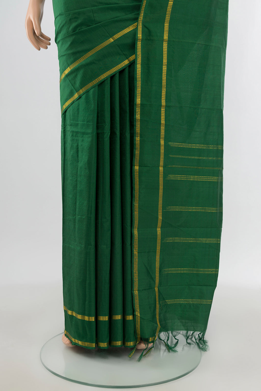 Pleats and pallu of Bottle Green Kanchipuram Silk Saree with Plain Body and Zari Border. 
