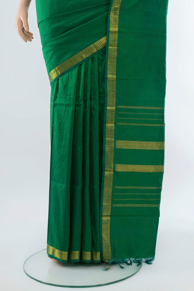 Pleats and pallu of Light Green Kanchipuram Silk Saree with Plain Body and Silk Border. 