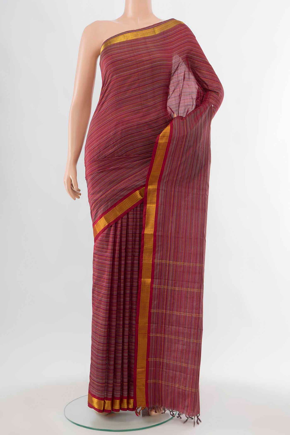 Maroon Kanchipuram Silk Saree with Stripes on the body and Zari Border displayed on a mannequin