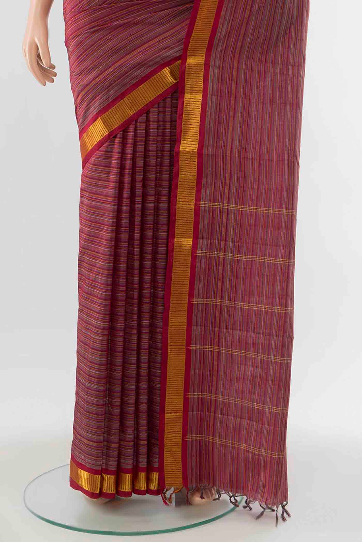 Pleats and pallu of Maroon Kanchipuram Silk Saree with Stripes on the body and Zari Border