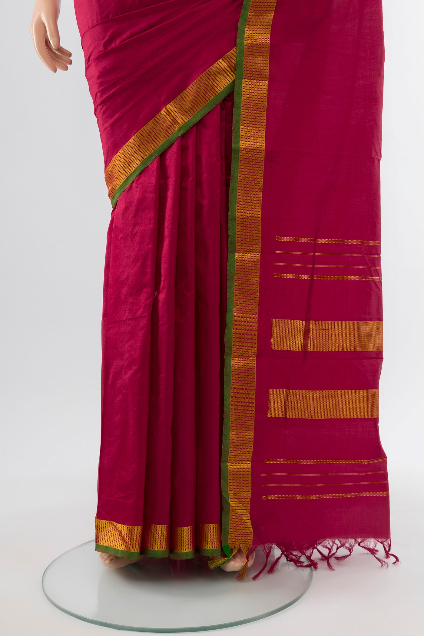 Pleats and pallu of Maroon Kanjivaram Silk Saree with Plain Body and Silk Border. 