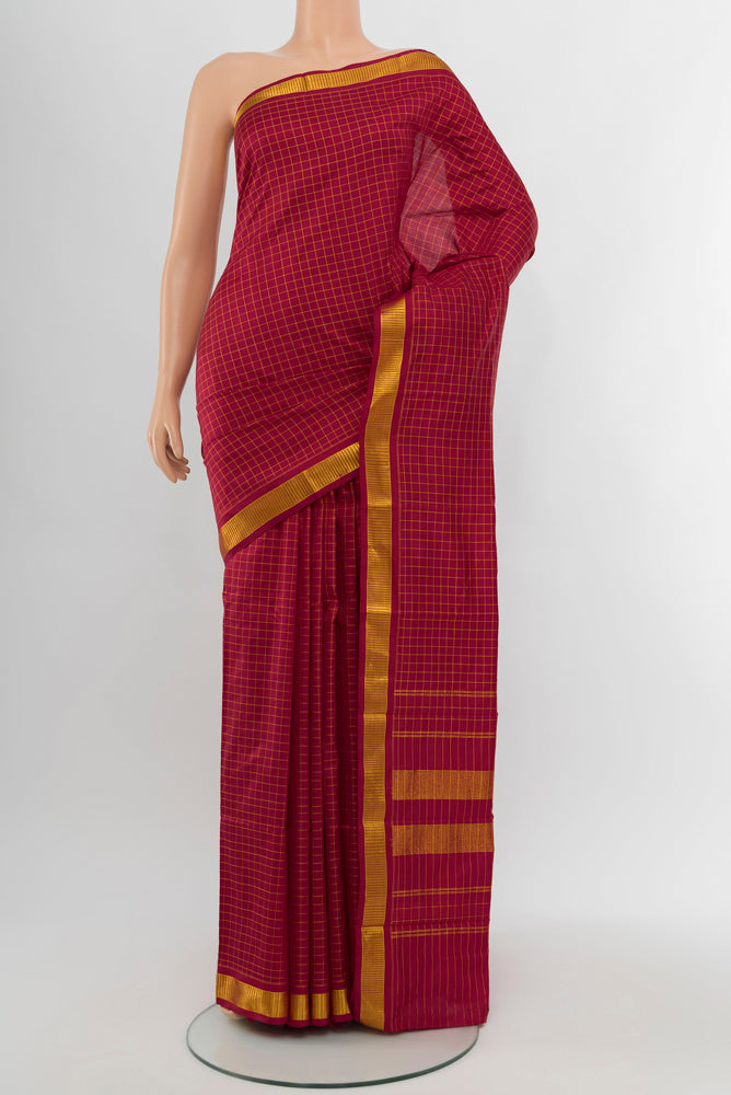 Maroon Kanjivaram Silk Saree with Checked design on the body and Silk Border.  displayed on a mannequin