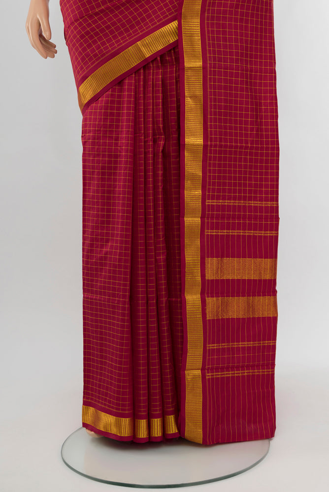 Pleats and pallu of Maroon Kanjivaram Silk Saree with Checked design on the body and Silk Border. 
