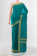 Pure Silk Pure Zari Dark Blue Kanjivaram Saree with Zari Butta on the body and Silk Border.  displayed on a mannequin