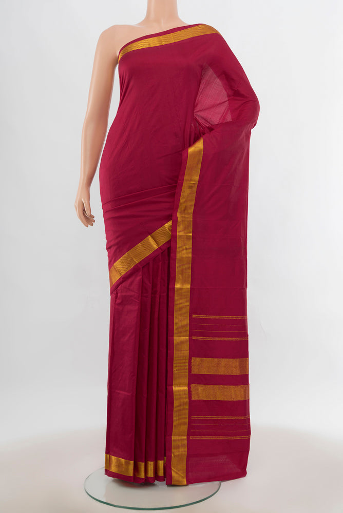Maroon Kanjivaram Silk Saree with Plain Body and Silk Border.  displayed on a mannequin