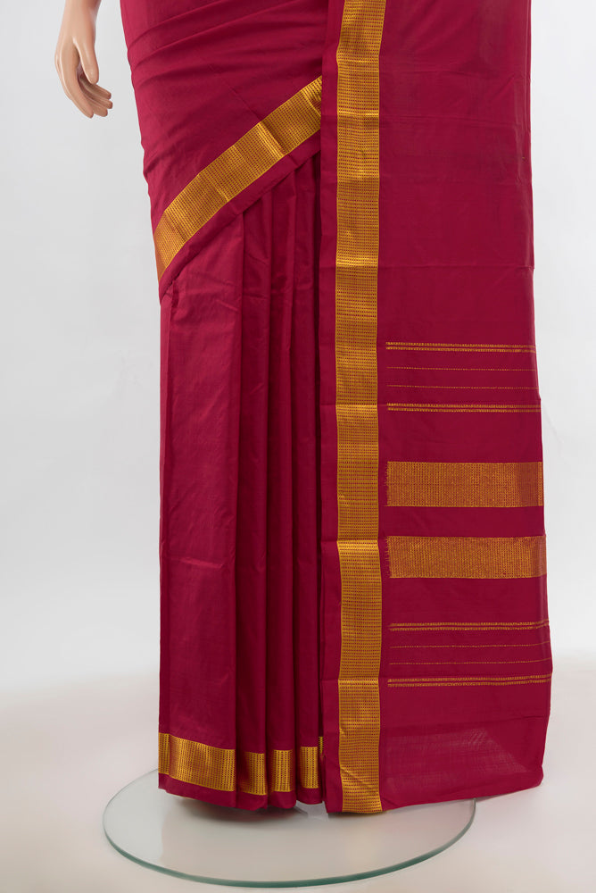 Pleats and pallu of Maroon Kanjivaram Silk Saree with Plain Body and Silk Border. 