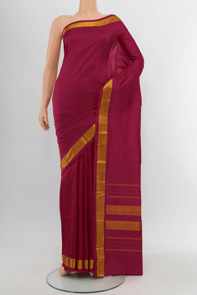 Maroon Kanjivaram Silk Saree with Plain Body and Silk Border.  displayed on a mannequin