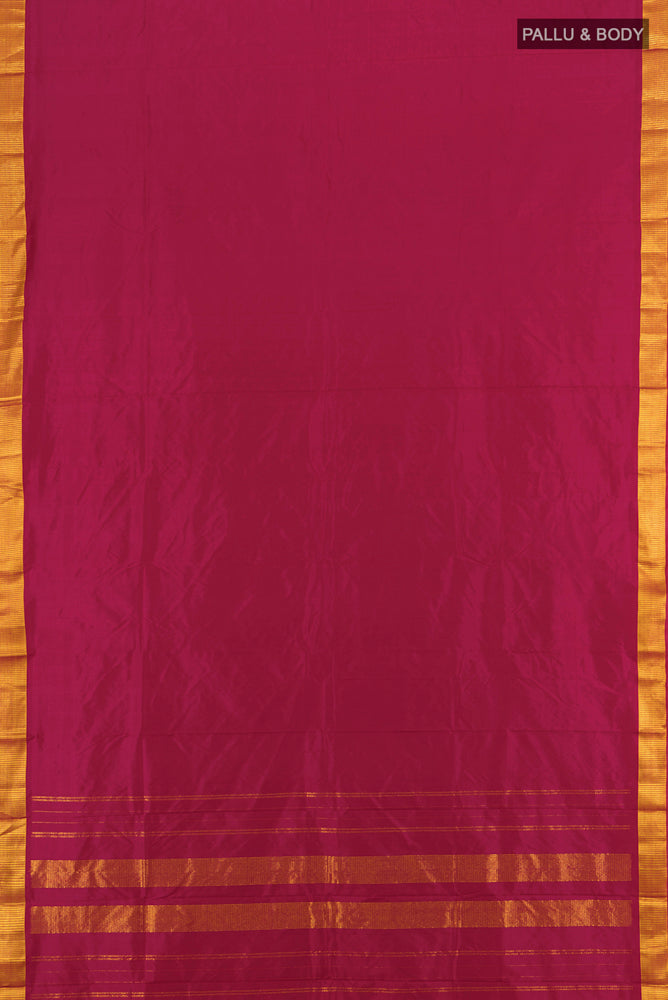 Flat view of Maroon Kanjivaram Silk Saree with Plain Body and Silk Border. 