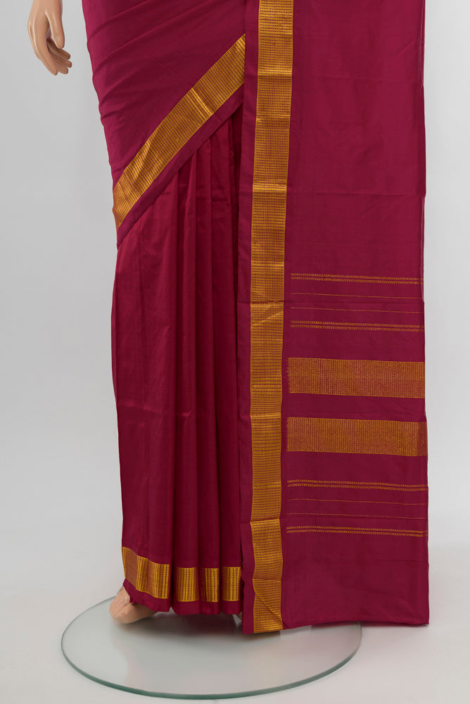 Pleats and pallu of Maroon Kanjivaram Silk Saree with Plain Body and Silk Border. 