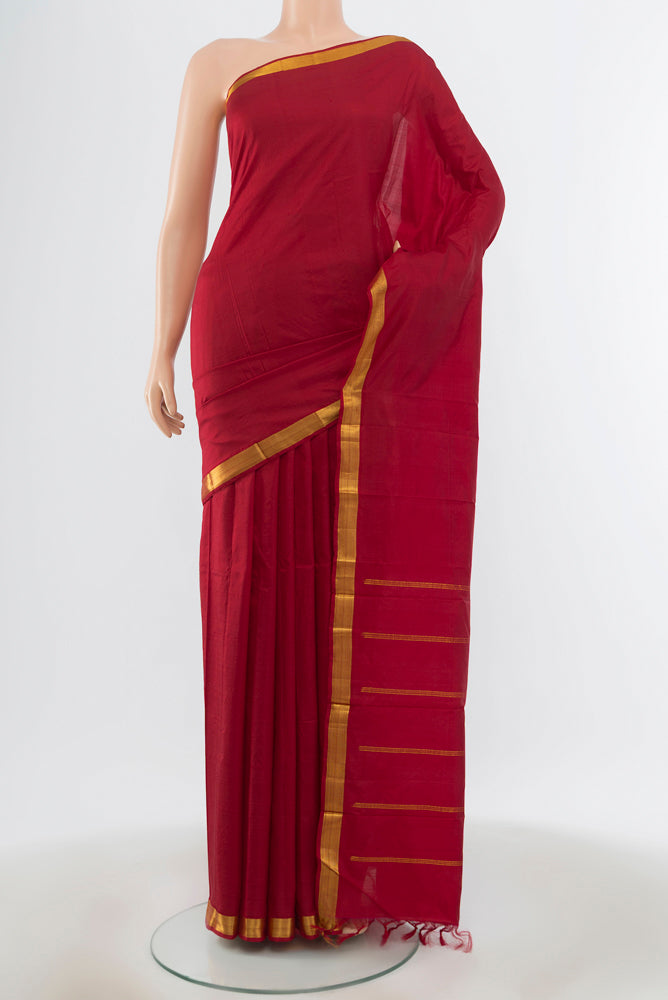 Maroon Kanchipuram Silk Saree with Plain Body and Silk Border.  displayed on a mannequin
