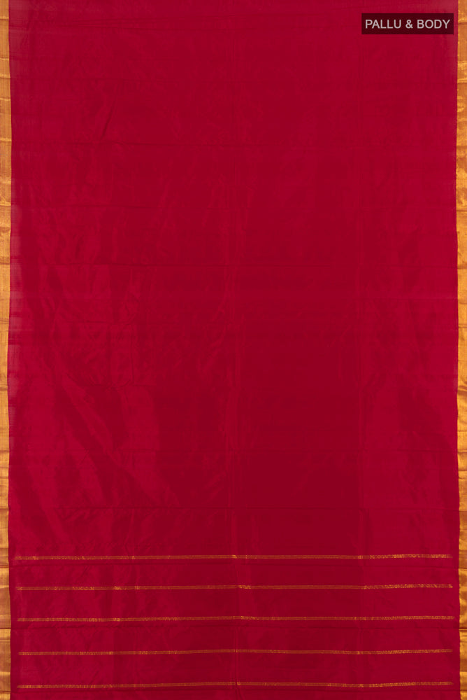 Flat view of Maroon Kanchipuram Silk Saree with Plain Body and Silk Border. 