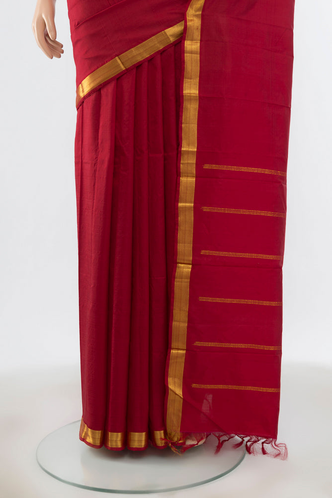 Pleats and pallu of Maroon Kanchipuram Silk Saree with Plain Body and Silk Border. 