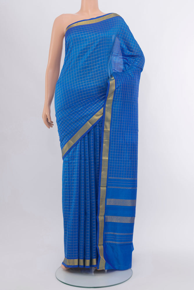 Light Blue Kanchipuram Silk Saree with Checked design on the body and Silk Border.  displayed on a mannequin