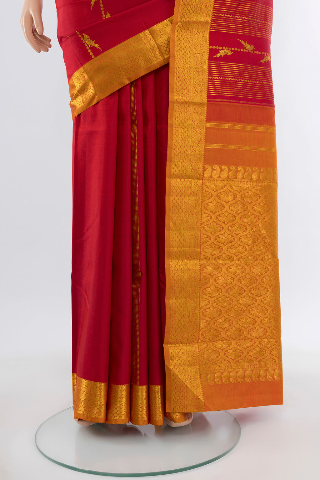 Pleats and pallu of Maroon Kanjivaram Silk Saree with Zari Butta on the body and Silk Border. 