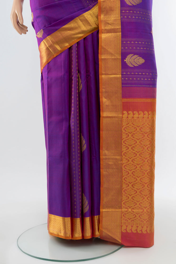 Pleats and pallu of Purple Kanjivaram Silk Saree with Zari Butta on the body and Silk Border. 