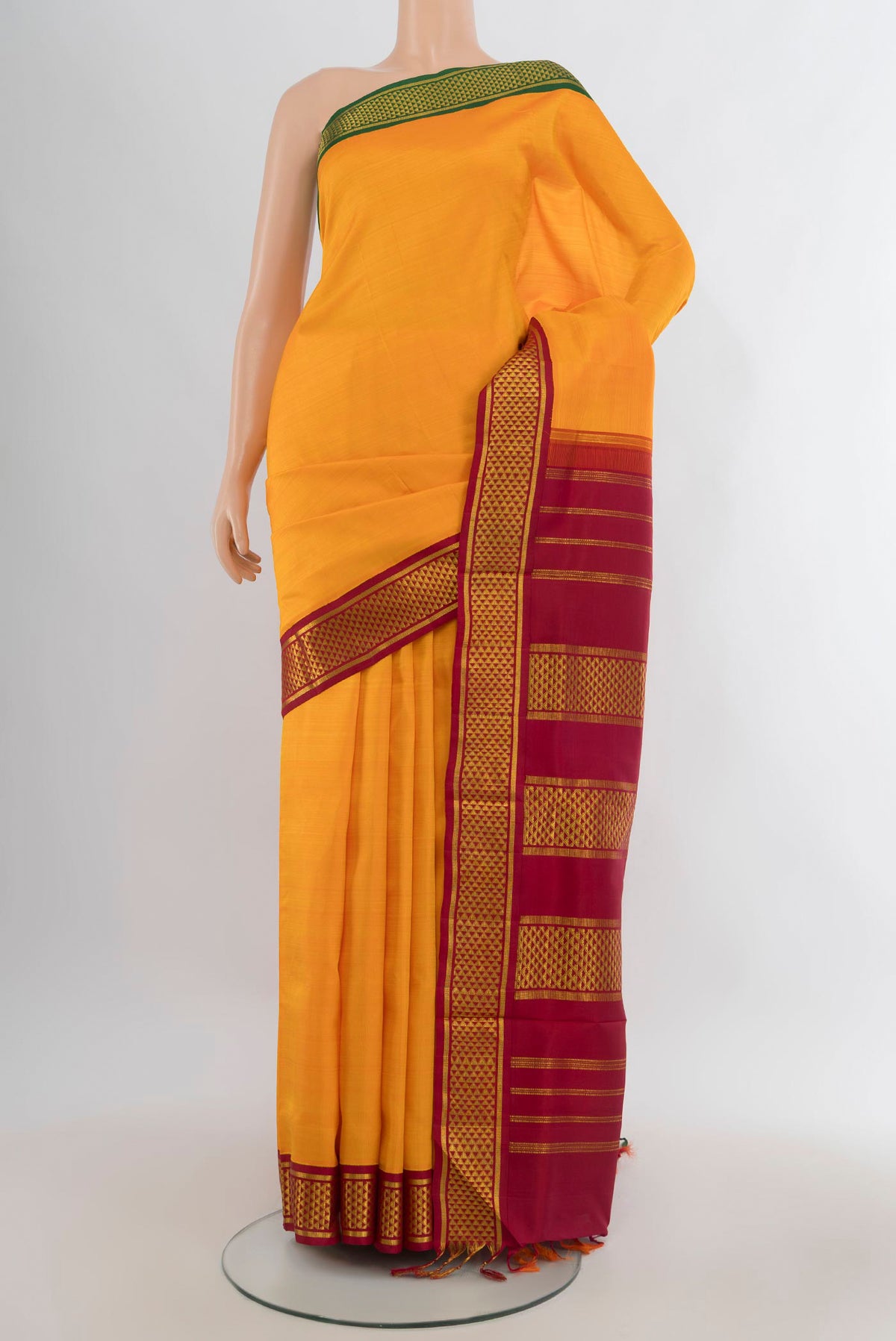 Pure Silk Yellow Kanchipuram Nine Yards Saree with Plain Body and Ganga Jamuna Border.  displayed on a mannequin
