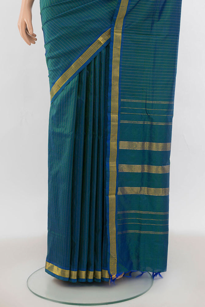 Pleats and pallu of Peacock Blue Kanjivaram Silk Nine Yards Saree with Zari Butta on the body and Silk Border. 