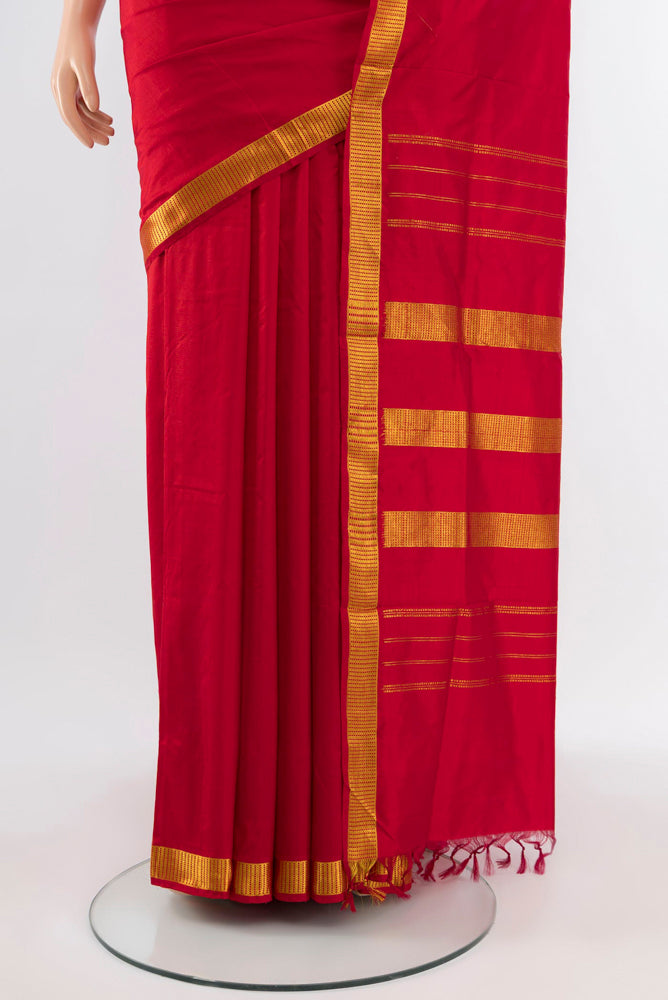 Pleats and pallu of Rust Kanjivaram Silk Nine Yards Saree with Plain Body and Silk Border. 