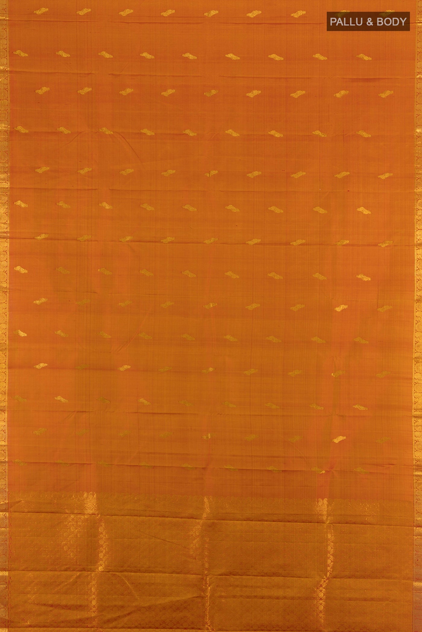 Flat view of Rust Kanchipuram Silk Saree with Zari Butta on the body and Silk Border. 