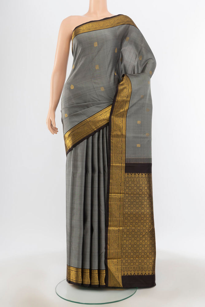 Pure Silk Pure Zari Davys Grey Kanjivaram Saree with Zari Butta on the body and Silk Border.  displayed on a mannequin