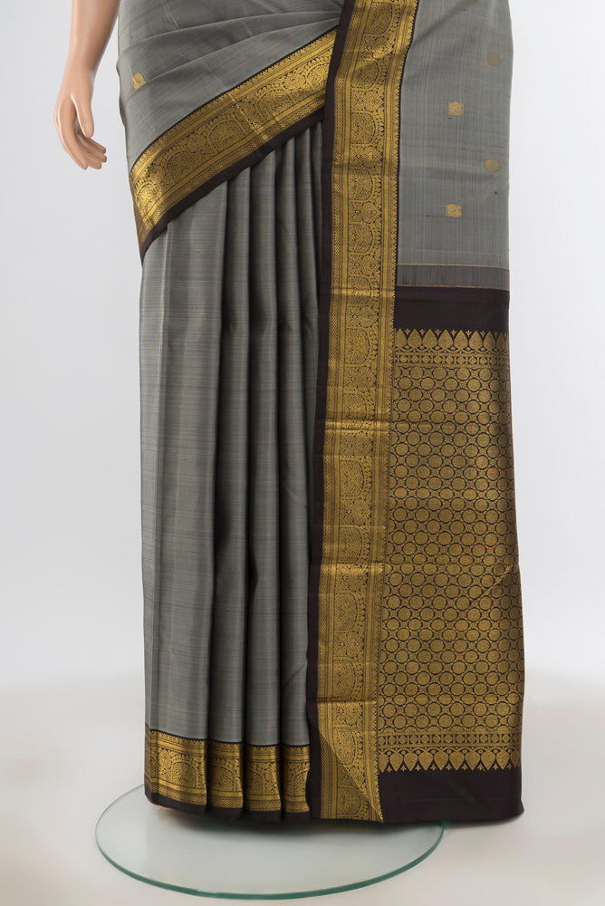 Pleats and pallu of Pure Silk Pure Zari Davys Grey Kanjivaram Saree with Zari Butta on the body and Silk Border. 